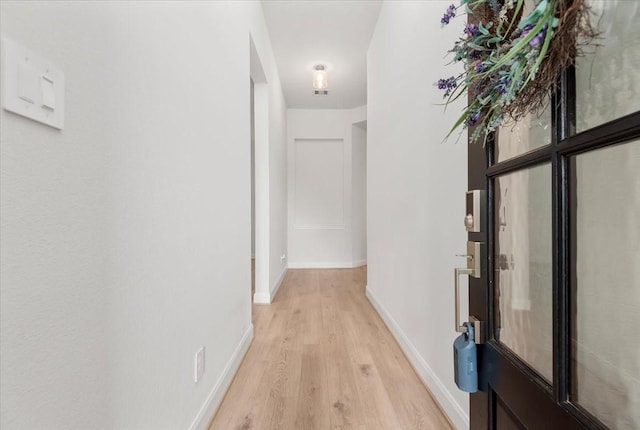 12831 Raemoir Dr, Humble, TX 77346 - corridor featuring light wood finished floors and baseboards