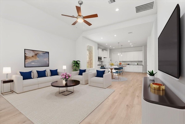 12831 Raemoir Dr, Humble, TX 77346 - living area with light wood-type flooring, a ceiling fan, and recessed lighting
