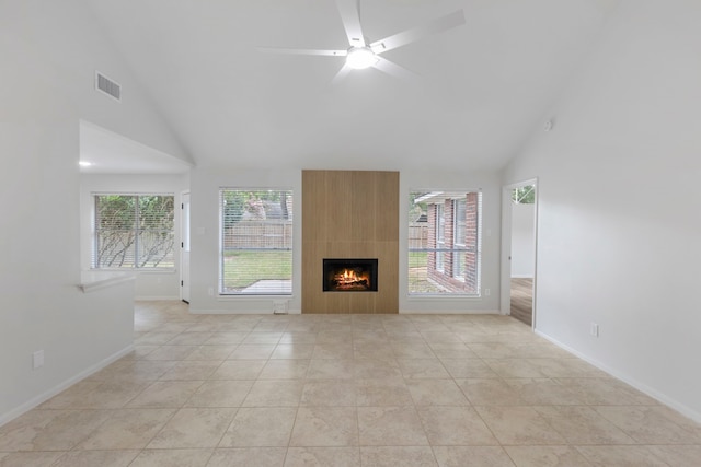 1815 Moston Dr, Spring, TX 77386 - unfurnished living room featuring high vaulted ceiling, a large fireplace, ceiling fan, and light tile patterned floors