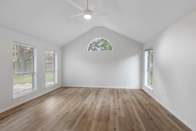 1815 Moston Dr, Spring, TX 77386 - unfurnished room with vaulted ceiling, healthy amount of natural light, ceiling fan, and light wood finished floors