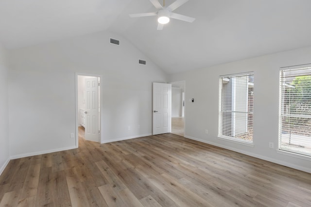 1815 Moston Dr, Spring, TX 77386 - unfurnished bedroom featuring high vaulted ceiling, light wood finished floors, ceiling fan, and ensuite bathroom