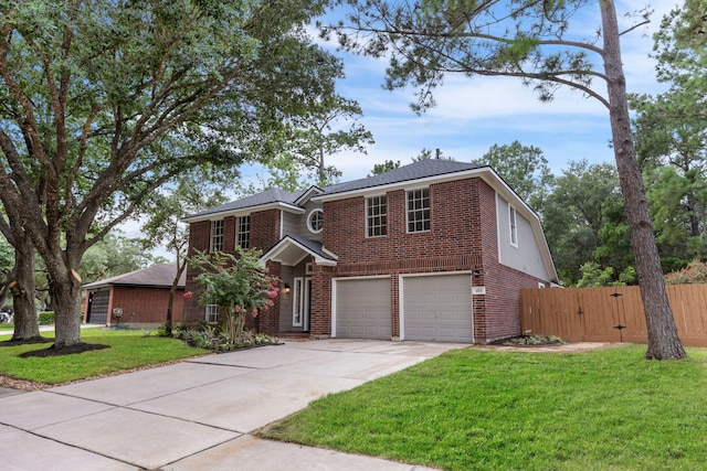 1815 Moston Dr, Spring, TX 77386 - traditional-style house featuring a garage, brick siding, driveway, and a gate