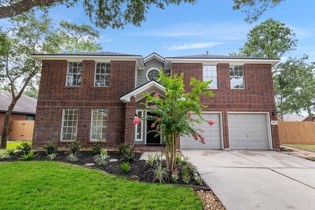 1815 Moston Dr, Spring, TX 77386 - traditional-style house with an attached garage, driveway, and brick siding