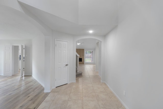1815 Moston Dr, Spring, TX 77386 - hallway featuring arched walkways and light tile patterned flooring