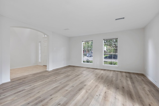1815 Moston Dr, Spring, TX 77386 - spare room with light wood-style flooring and arched walkways
