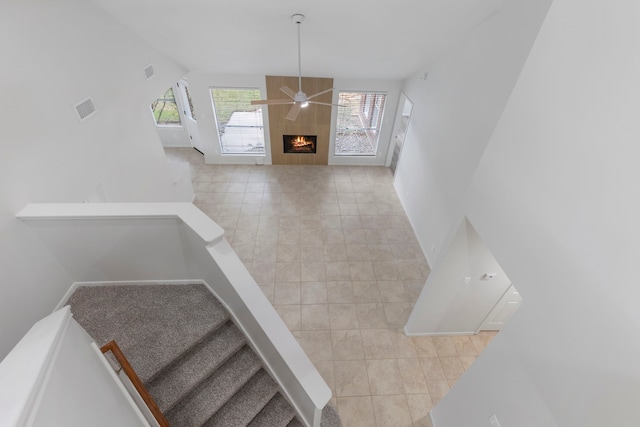 1815 Moston Dr, Spring, TX 77386 - stairway featuring tile patterned flooring, a ceiling fan, and vaulted ceiling