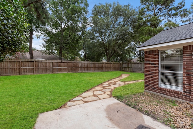 1815 Moston Dr, Spring, TX 77386 - fenced backyard with a patio area