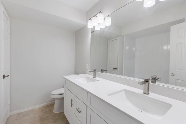 1815 Moston Dr, Spring, TX 77386 - bathroom featuring double vanity and toilet