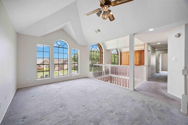 2701 11th St N, Texas City, TX 77590 - unfurnished living room with carpet, ceiling fan, and high vaulted ceiling