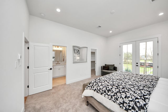 4415 Coke St Unit B, Houston, TX 77020 - bedroom with french doors, access to outside, light carpet, connected bathroom, and recessed lighting