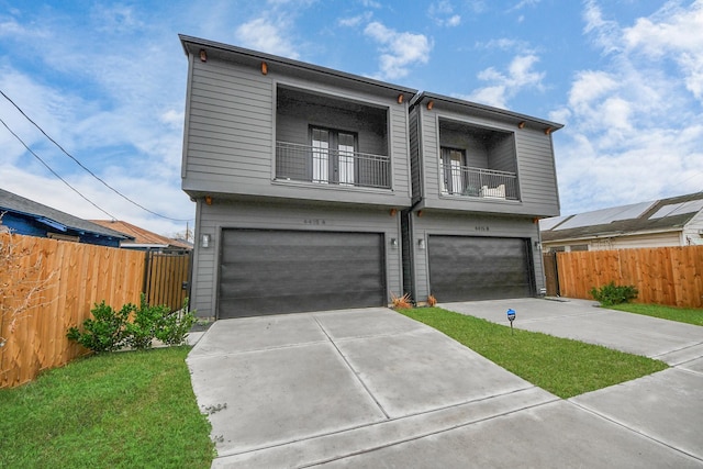 4415 Coke St Unit B, Houston, TX 77020 - view of front of house with a balcony, a garage, and driveway