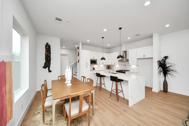 4415 Coke St Unit B, Houston, TX 77020 - dining room with light wood-type flooring, recessed lighting, and plenty of natural light