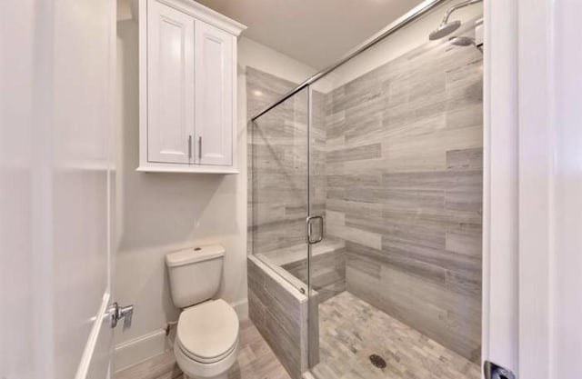 4041 Leeland St, Houston, TX 77023 - bathroom featuring a stall shower and toilet