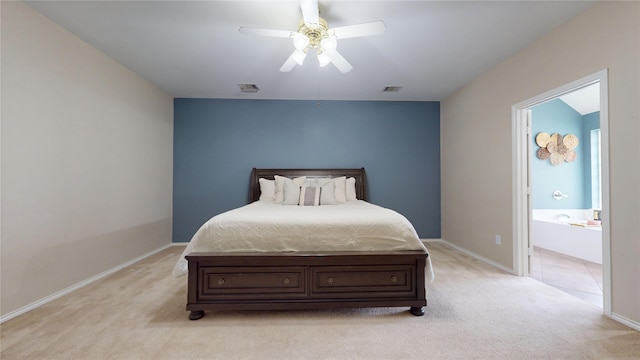 18118 Castle Rain Dr, Humble, TX 77346 - bedroom featuring light colored carpet, ensuite bathroom, and ceiling fan