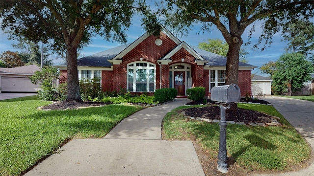 18118 Castle Rain Dr, Humble, TX 77346 - view of front facade with brick siding, a front lawn, and roof with shingles
