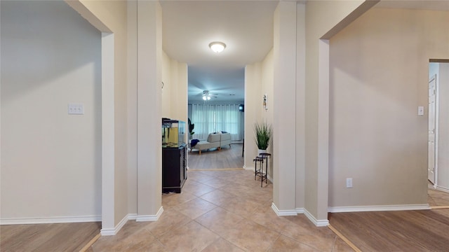 18118 Castle Rain Dr, Humble, TX 77346 - corridor featuring light tile patterned floors and baseboards