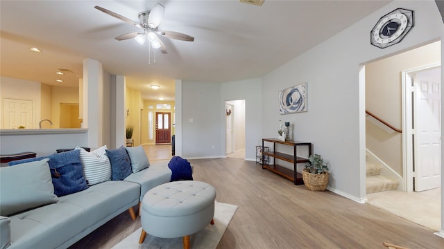 18118 Castle Rain Dr, Humble, TX 77346 - living area with ceiling fan, light wood-style floors, recessed lighting, and stairs