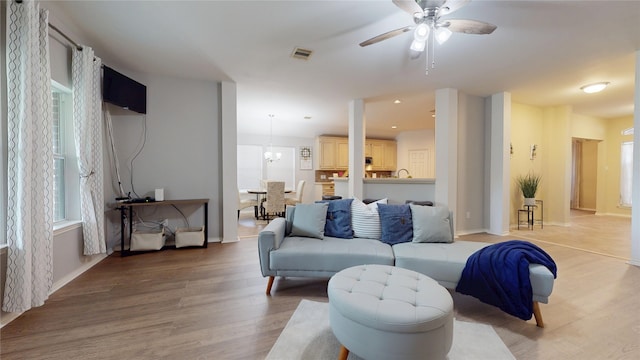 18118 Castle Rain Dr, Humble, TX 77346 - living room with a ceiling fan and light wood-style flooring