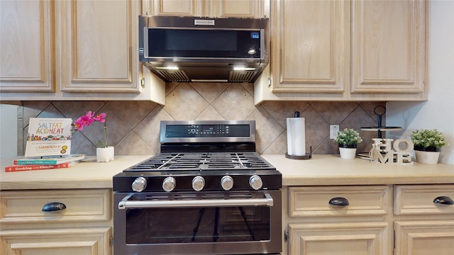18118 Castle Rain Dr, Humble, TX 77346 - kitchen featuring gas range oven, cream cabinets, and light countertops