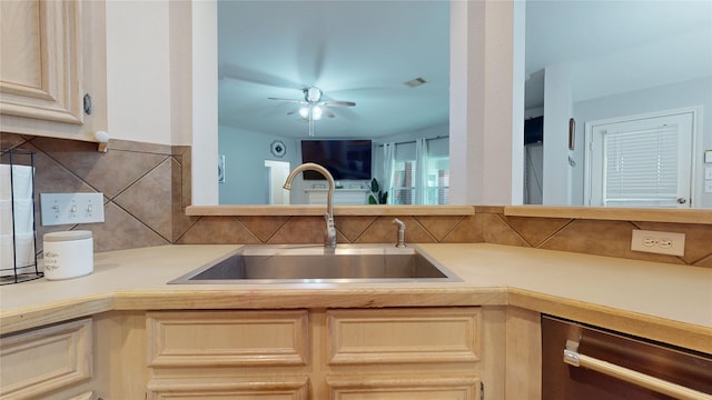 18118 Castle Rain Dr, Humble, TX 77346 - kitchen with stainless steel dishwasher, decorative backsplash, light countertops, and a ceiling fan