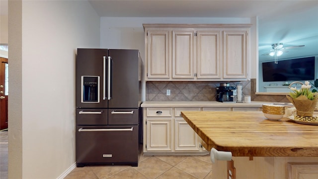 18118 Castle Rain Dr, Humble, TX 77346 - kitchen featuring high end fridge, decorative backsplash, light tile patterned floors, a ceiling fan, and wood counters