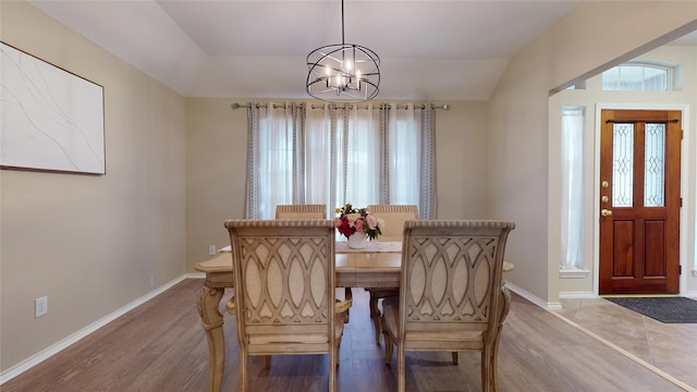 18118 Castle Rain Dr, Humble, TX 77346 - dining room featuring wood finished floors, a chandelier, plenty of natural light, and lofted ceiling