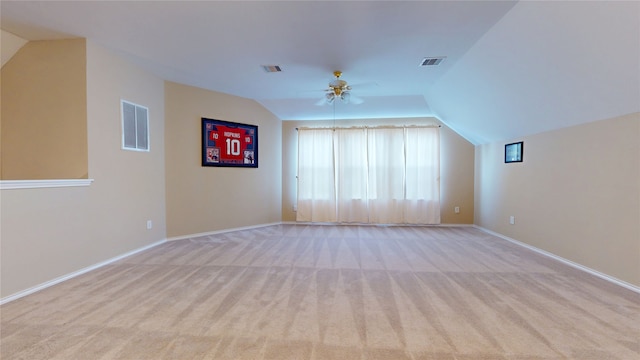 18118 Castle Rain Dr, Humble, TX 77346 - unfurnished living room featuring lofted ceiling, a ceiling fan, and light colored carpet