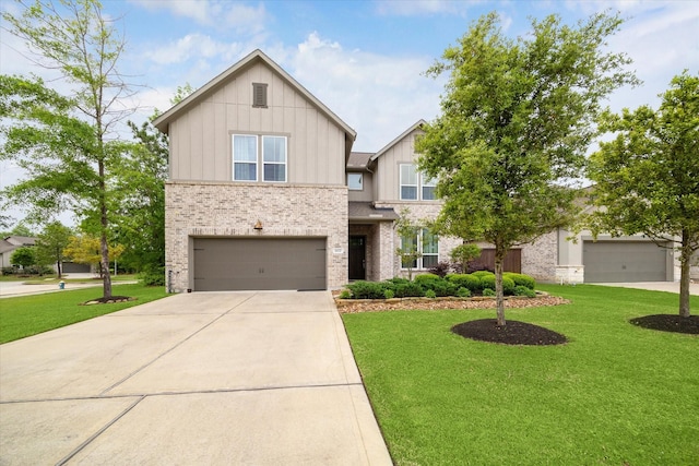16630 Polletts Cove Ct, Humble, TX 77346 - view of front of property with board and batten siding, a front lawn, brick siding, concrete driveway, and a garage