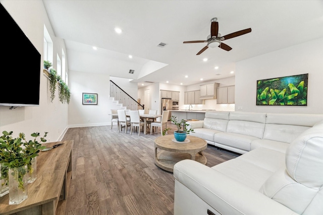 16630 Polletts Cove Ct, Humble, TX 77346 - living area featuring a ceiling fan, wood finished floors, recessed lighting, and stairway