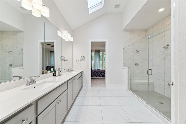 16630 Polletts Cove Ct, Humble, TX 77346 - bathroom featuring marble finish flooring, vaulted ceiling, double vanity, a shower stall, and ensuite bathroom