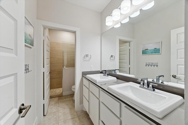 16630 Polletts Cove Ct, Humble, TX 77346 - bathroom with double vanity, tiled shower, and tile patterned floors