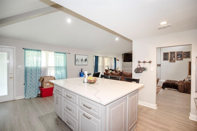 6203 Wickwillow Ln, Alvin, TX 77511 - kitchen featuring a kitchen island, open floor plan, light wood-style floors, and recessed lighting