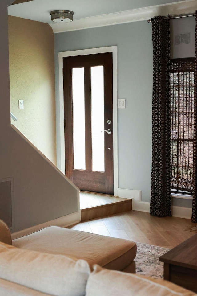 1620 Wellington Pl Unit 204, Beaumont, TX 77706 - entryway featuring wood finished floors and crown molding