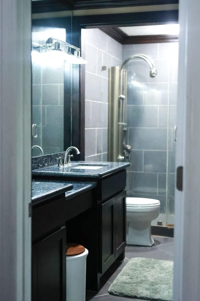 1620 Wellington Pl Unit 204, Beaumont, TX 77706 - full bath featuring vanity, tile patterned flooring, a stall shower, and tile walls