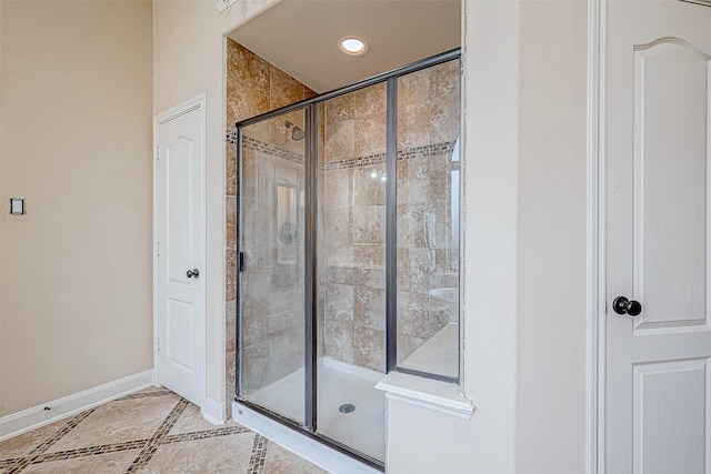 16011 Maple Shores Dr, Houston, TX 77044 - full bath featuring a shower stall, inlaid floor details, and recessed lighting