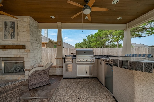 16011 Maple Shores Dr, Houston, TX 77044 - view of patio featuring an outdoor stone fireplace, area for grilling, and ceiling fan
