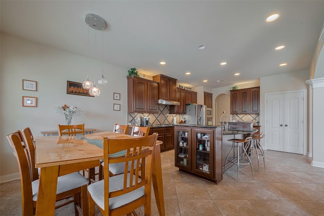 16011 Maple Shores Dr, Houston, TX 77044 - dining room with arched walkways and recessed lighting