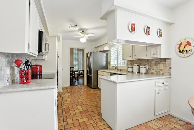 2618 Fontana Dr, Houston, TX 77043 - kitchen featuring stainless steel appliances, a ceiling fan, light countertops, and brick patterned floors