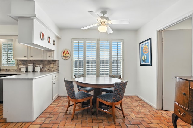 2618 Fontana Dr, Houston, TX 77043 - dining space featuring ceiling fan and brick floors