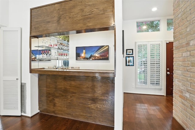 2618 Fontana Dr, Houston, TX 77043 - indoor wet bar with wood-type flooring and brick wall