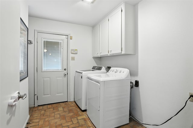 2618 Fontana Dr, Houston, TX 77043 - washroom with separate washer and dryer, brick flooring, and cabinet space