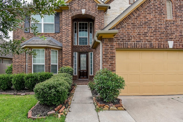 20315 Cypress Poll Dr, Cypress, TX 77433 - property entrance featuring brick siding and an attached garage