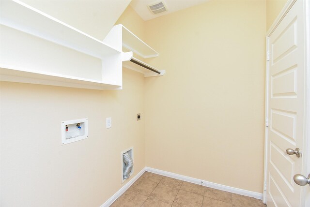 20315 Cypress Poll Dr, Cypress, TX 77433 - laundry area with washer hookup, light tile patterned floors, and electric dryer hookup