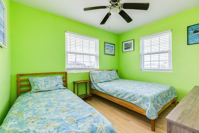 430 Jettyview Rd, Surfside Beach, TX 77541 - bedroom featuring wood finished floors and ceiling fan