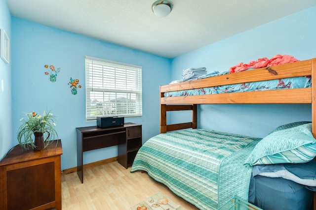 430 Jettyview Rd, Surfside Beach, TX 77541 - bedroom featuring wood finished floors and baseboards
