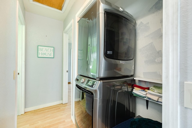 430 Jettyview Rd, Surfside Beach, TX 77541 - laundry room featuring estacked washer and dryer and wood finished floors