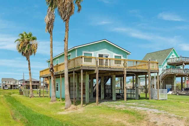 430 Jettyview Rd, Surfside Beach, TX 77541 - back of property with a deck and a yard