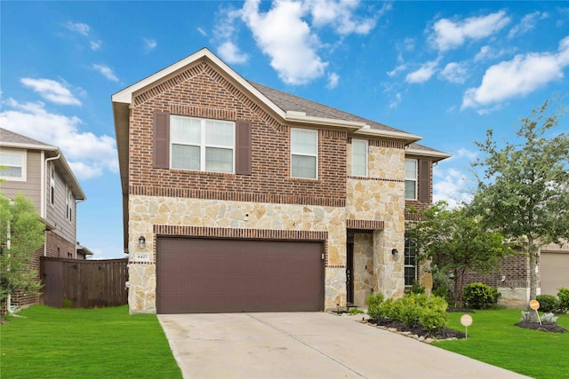 4427 Silvergrass Ln, Katy, TX 77493 - view of front facade featuring stone siding, an attached garage, concrete driveway, and brick siding