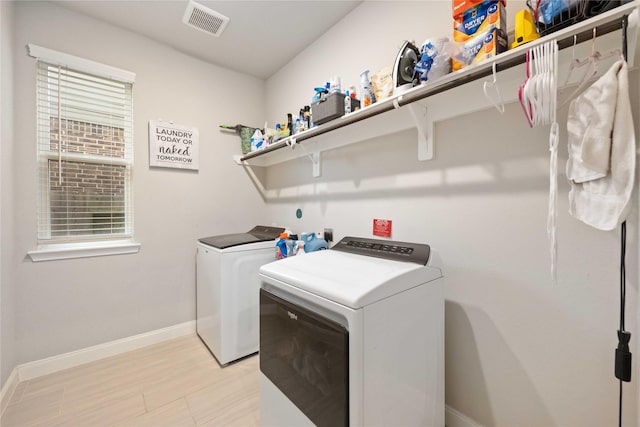 4427 Silvergrass Ln, Katy, TX 77493 - laundry area with separate washer and dryer and baseboards