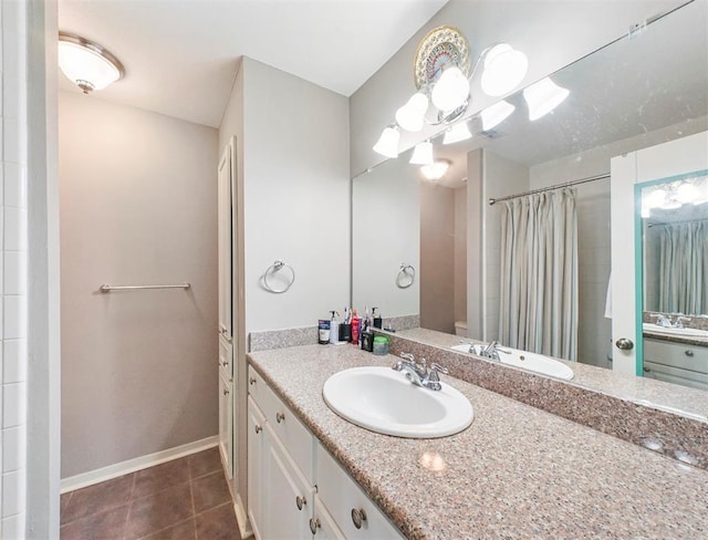 1691 W Sam Houston Pkwy S, Houston, TX 77042 - bathroom featuring tile patterned floors, vanity, and curtained shower
